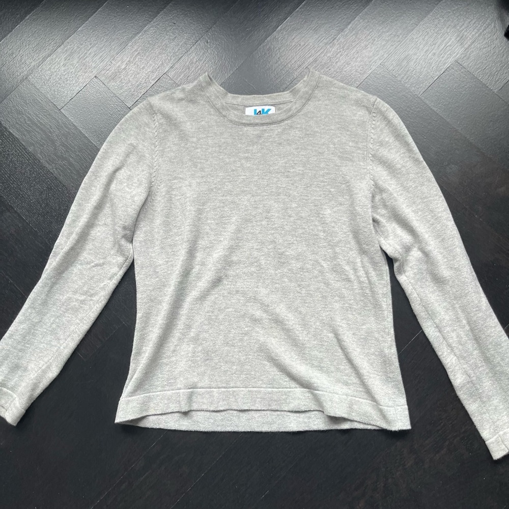 Nice light gray sweater with smiley faces on elbows